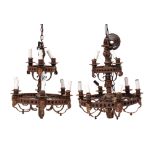 A pair of wrought iron nine light electroliers in Gothic revival taste,