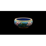 A group of thirteen items of Chinese and Japanese cloisonne variously decorated with flowers,