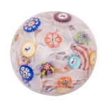 A dated Baccarat spaced millefiori paperweight with central butterfly cane surrounded by a stag,