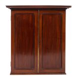 An early 19th Century mahogany estate cabinet with a moulded cornice,