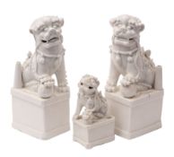 A pair of Chinese blanc de chine incense holders and one smaller,