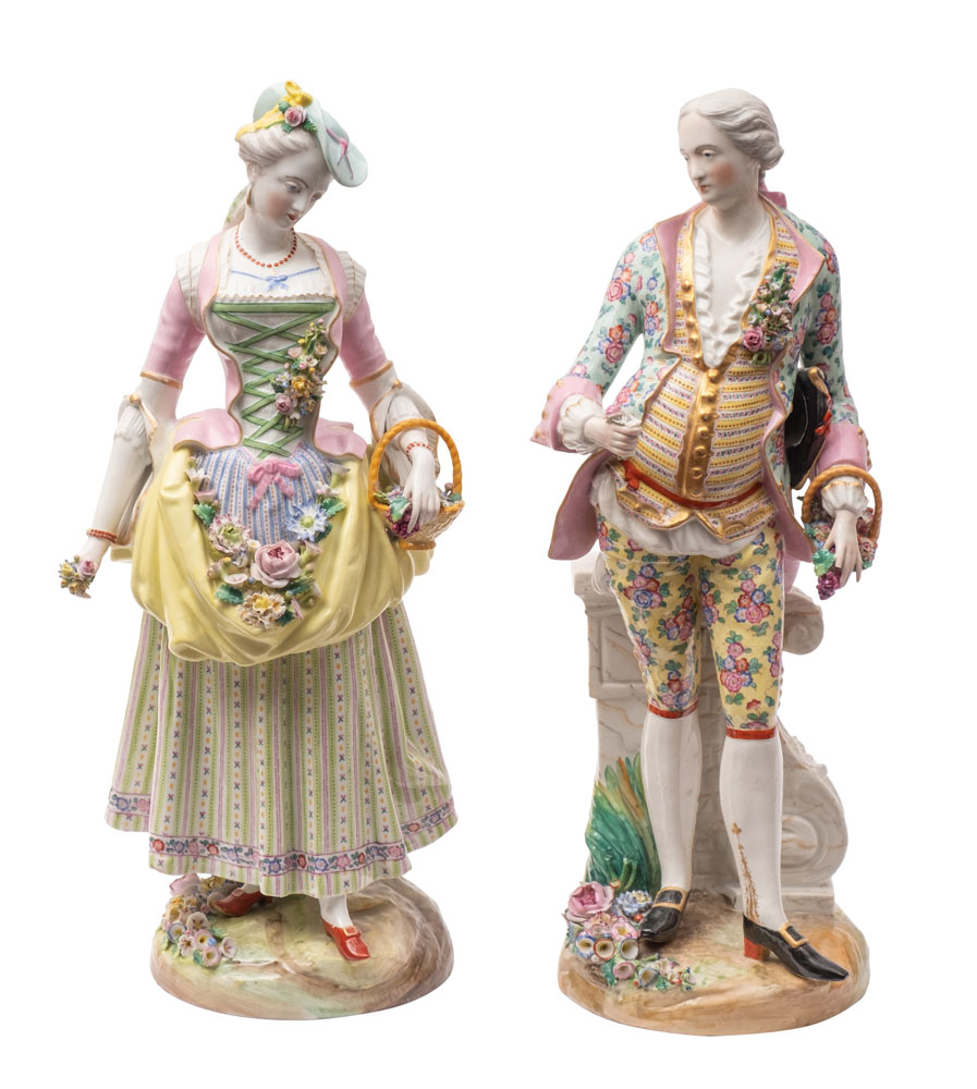 A pair of Continental porcelain figures in the Meissen manner of a gallant and his companion,