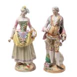 A pair of Continental porcelain figures in the Meissen manner of a gallant and his companion,