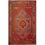A Hamadan rug, the hexagonal hooked field with a hexagonal stellar pole medallion,