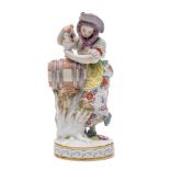 A Meissen figure of a girl vintner modelled after the original by Michael Victor Acier wearing a