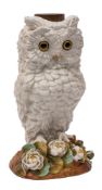A German porcelain owl table lamp base naturalistically modelled on mound base applied with flowers