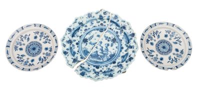A large Savona blue and white maiolica moulded dish and a pair of Dutch blue and white delftware