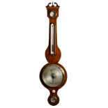 A mahogany wheel barometer having an eight-inch round silvered dial with usual barometer markings,