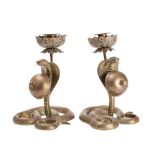 A pair of unusual Indian brass snake combination table bell/candlesticks each in the form of a