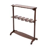 A 19th Century mahogany boot rack surmounted by a rectangular shelf,