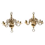 Two similar brass six light chandeliers,