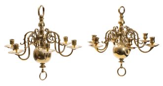 Two similar brass six light chandeliers,