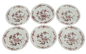 A set of six Dutch delftware plates, each painted in manganese in the Chinese manner with peony,