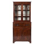 A George IV yew-wood veneered and crossbanded secretaire bookcase,