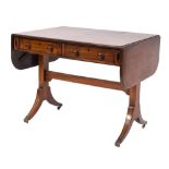 A Regency mahogany and inlaid sofa table, bordered with boxwood and ebony lines,