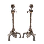 A pair of bronze candlesticks in Pompeiian revival taste,