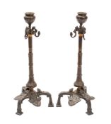 A pair of bronze candlesticks in Pompeiian revival taste,