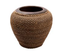 A large Balinese earthenware bowl clad in wicker work, 30cm high.