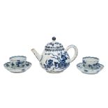 A small Chinese blue and white ribbed teapot and cover and a pair of similar teabowls and saucers,