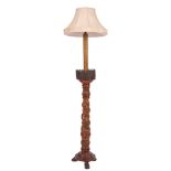 A Continental carved wood standard lamp,