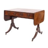 An early 19th Century mahogany and inlaid sofa table, bordered with boxwood and ebony lines,