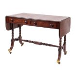 A Regency mahogany and inlaid sofa table, bordered with ebony lines,