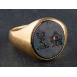 A Victorian, 18ct gold, bloodstone signet ring, engraved with heraldic device,