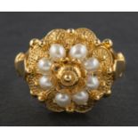 A seed pearl and cannetille ring, of flowerhead design, stamped '585', length of ring head ca. 1.