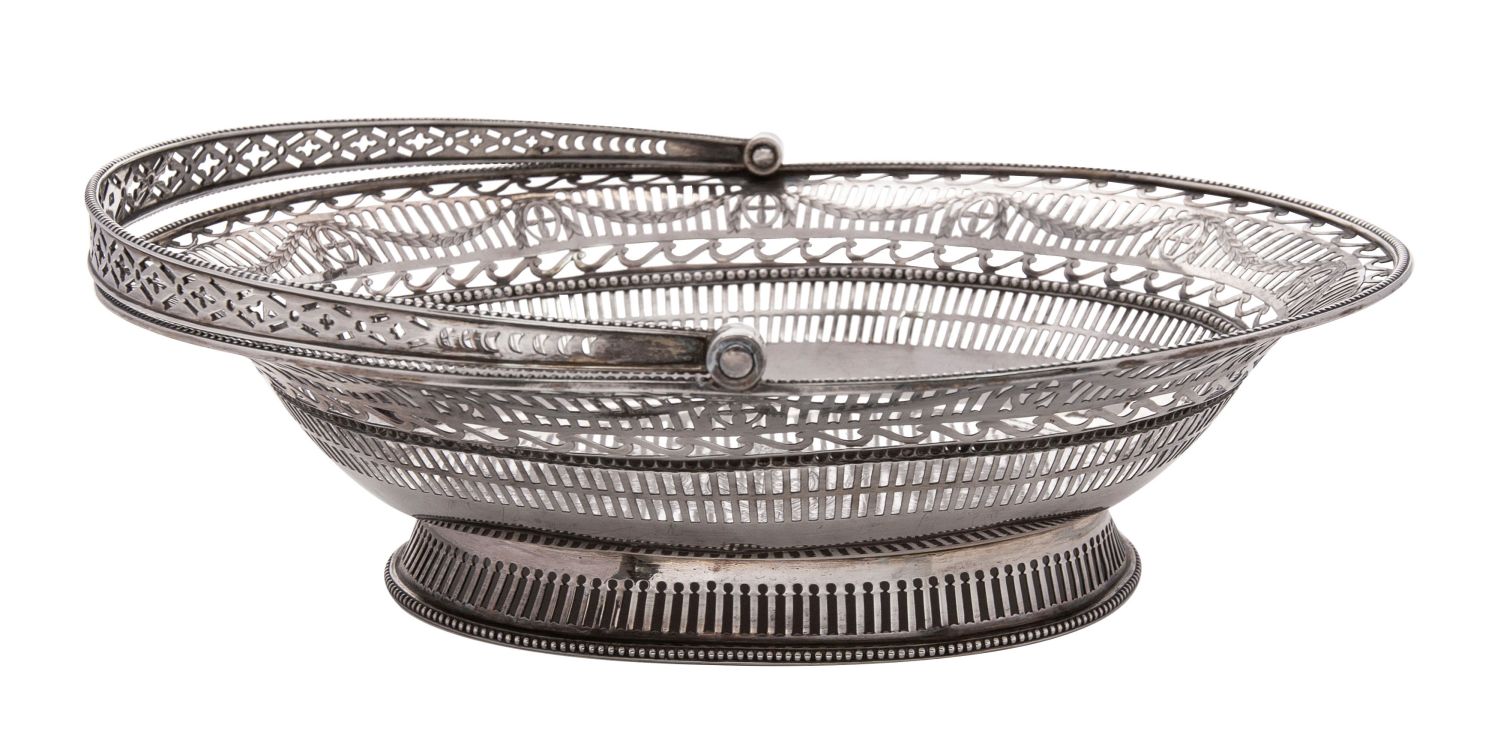 A George III silver swing handled bread basket, maker probably John Mappin, Sheffield, 1777,