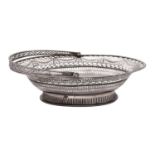 A George III silver swing handled bread basket, maker probably John Mappin, Sheffield, 1777,