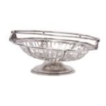A George V silver swing handled cake basket, Sheffield 1910, of shaped circular form,