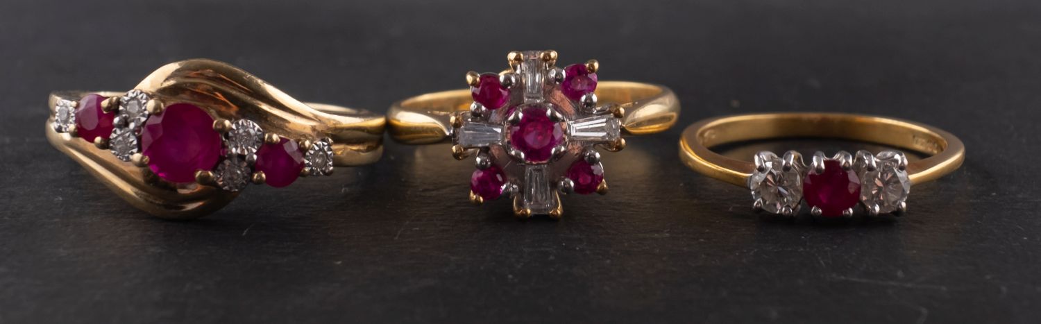 Three ruby and diamond rings, including an 18ct gold three-stone ring,