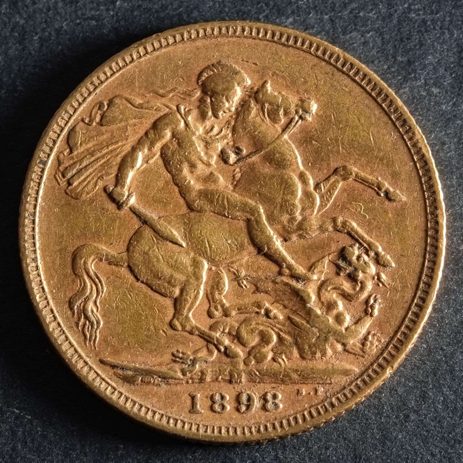 An 1898 Victorian Gold Sovereign of Melbourne Mint.