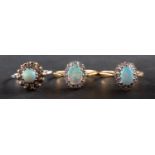 Three cabochon-cut opal and diamond cluster rings, including an 18ct gold ring,