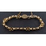 A 19th century, belcher-link bracelet with engraved, quadrapartite spacers, total length 17.