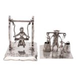 Two early 20th century silver toy models, of a milk man and two children,