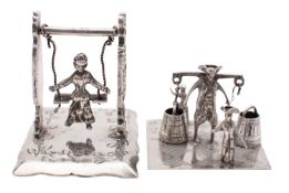 Two early 20th century silver toy models, of a milk man and two children,