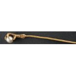A pearl tie-pin designed as an eagle's claw, diameter of pearl ca. 4.