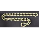 A jade bead necklace, diameter of beads ca. 9.5mms, total length ca. 106cm.