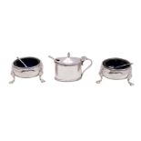 A pair of George III silver circular cauldron salts, maker Robert & David Hennell,