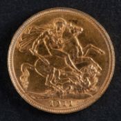 A George V gold sovereign coin, dated 1911, diameter ca. 22mms, total weight ca. 8gms.