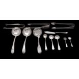 A mixed group of early 19th century flatware to include; a pair of Fiddle and Shell sugar tongs,