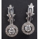 A pair of Ukrainian round, brilliant-cut diamond earrings,