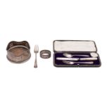 A small group of silver, to include;- a silver bottle coaster, London 1903, a silver dessert fork,