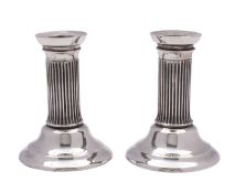 WITHDRAWN A pair of Edward VII silver dressing table candlesticks, Wolfsky & Co Ltd, London, 1901,