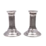 WITHDRAWN A pair of Edward VII silver dressing table candlesticks, Wolfsky & Co Ltd, London, 1901,