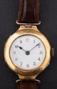 A 18ct gold lady's wristwatch the white enamel dial with Arabic numerals and blued steel spade
