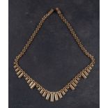 A panther-link, stepped-fringe necklace, stamped '375', total length ca. 43cm, total weight ca. 17.