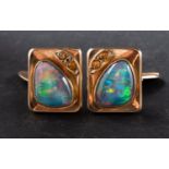 A pair of opal doublet cufflinks, with probably topaz highlights, stamped '9CT',