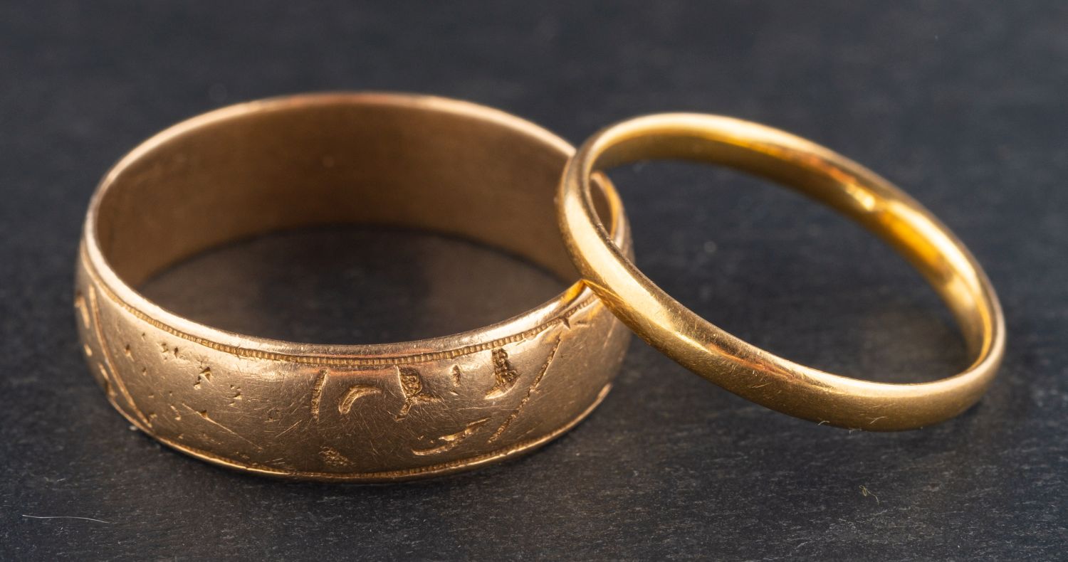 Two gold band rings, including an 18ct gold, Victorian band ring with engraved floral decoration,